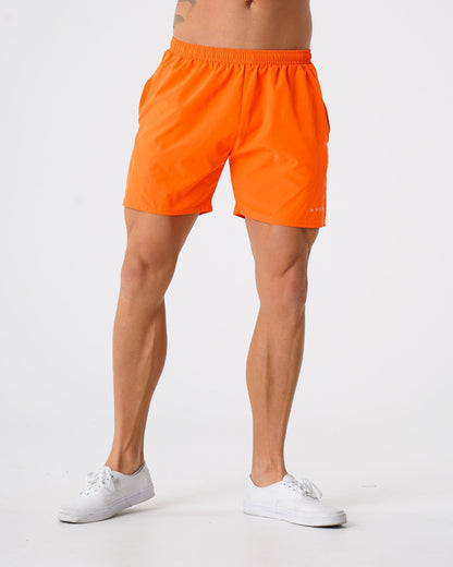 Men Orange Flex Shorts | NVGTN