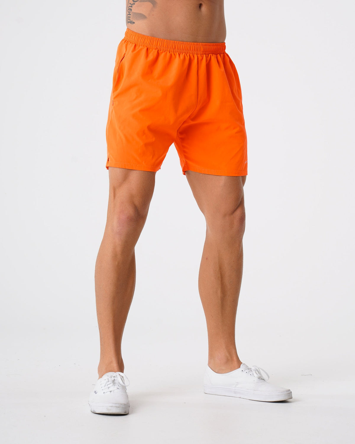 Men Orange Flex Shorts | NVGTN