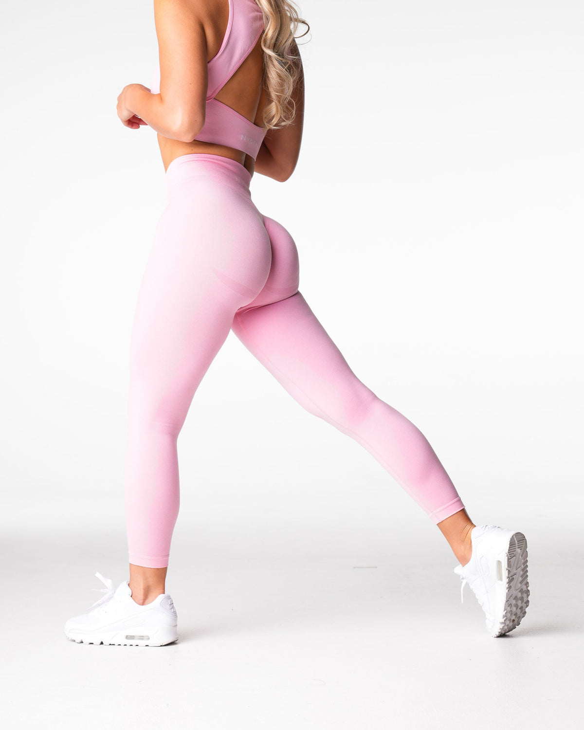 Women Baby Pink Mid Rise Contour Seamless Leggings | NVGTN